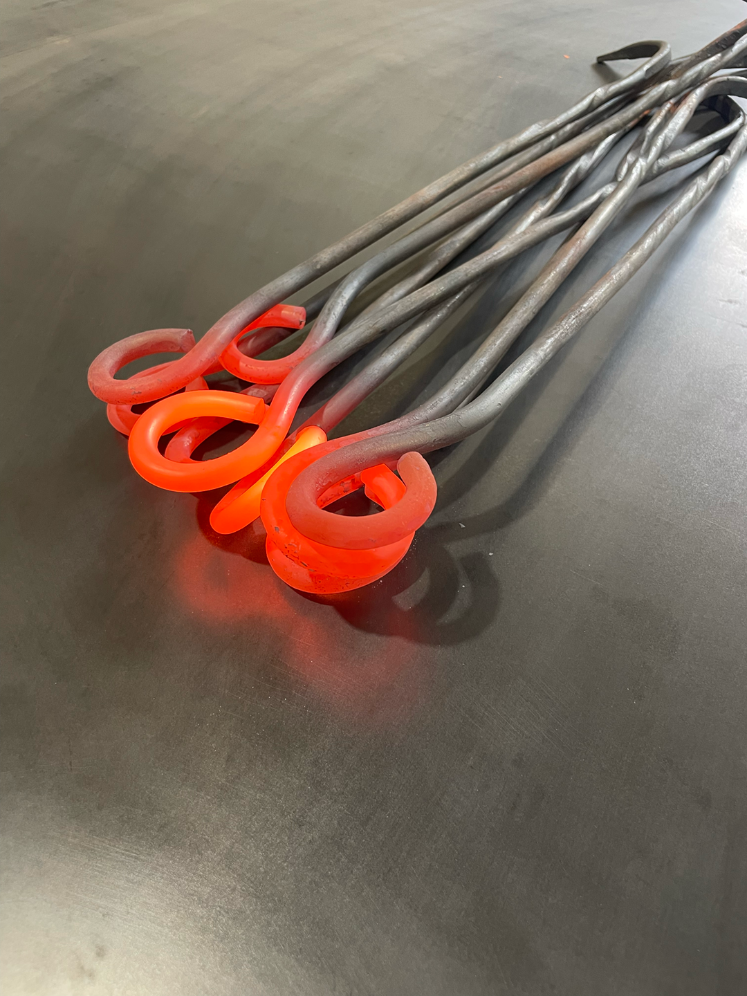 Red hot forged coal rakes