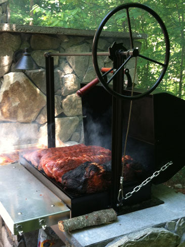 Lots of meat being cooked on a 1000 Series Braten Masonry customer installed Unit