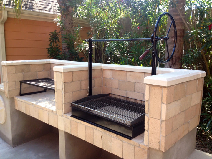 Newly installed Original Braten Campfire grill in customer built back patio surround